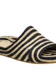 Estilo Emporio Shoes Woven Jute Slide worn by model in natural setting LUXAMORE 