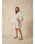 Estilo Emporio Stella Linen Dress - Lyla worn by model in natural setting LUXAMORE 