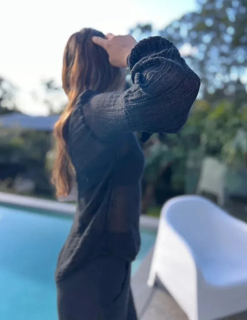 Estilo Emporio Stevie Top - Black worn by model in natural setting LUXAMORE 