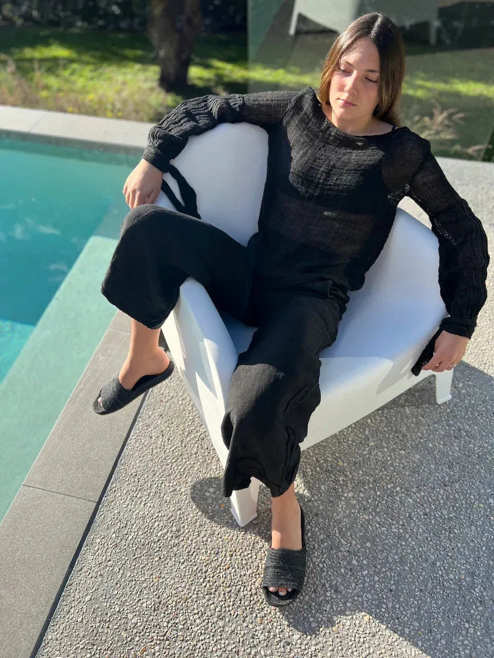 Estilo Emporio Stevie Top - Black worn by model in natural setting LUXAMORE 