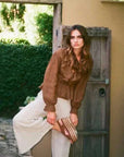 Estilo Emporio Tome Blouse - Tobacco worn by model in natural setting LUXAMORE 