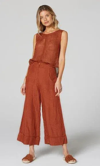 Estilo Emporio Linen Pant Tropez - Rust worn by model in natural setting LUXAMORE 