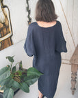 Woman Wearing Linen Dress V-neck Knot Front Midi Made in Italy Black - Dress LUXAMORE