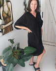 Woman Wearing Linen Dress V-neck Knot Front Midi Made in Italy Black - Dress LUXAMORE
