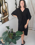 Woman Wearing Linen Dress V-neck Knot Front Midi Made in Italy Black - Dress LUXAMORE