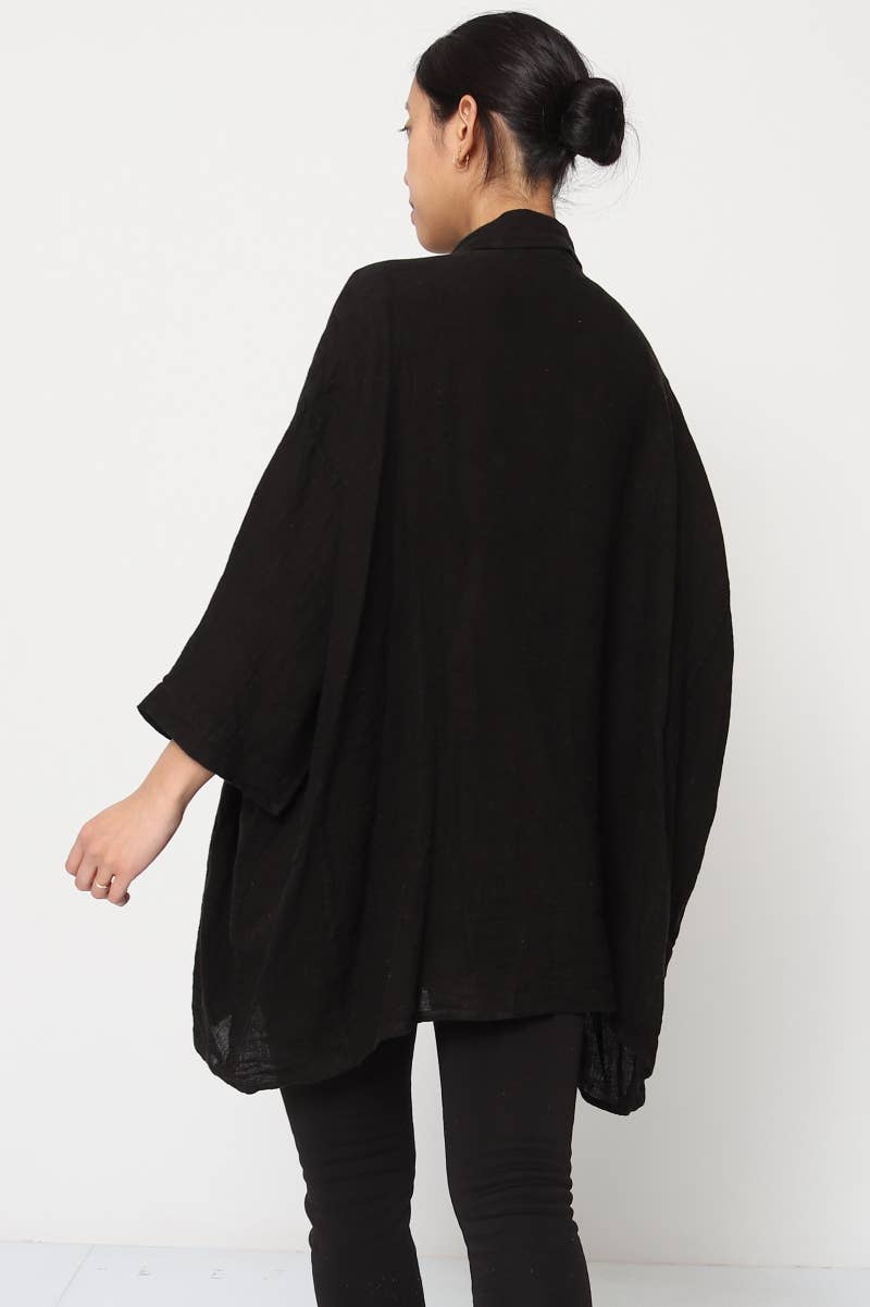 Linen Shirt Relaxed Oversized Button Front Pockets made in Italy Black worn by model in natural setting LUXAMORE 