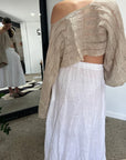 Linen Wrap Skirt With Pockets Made in Italy White worn by model in natural setting LUXAMORE 