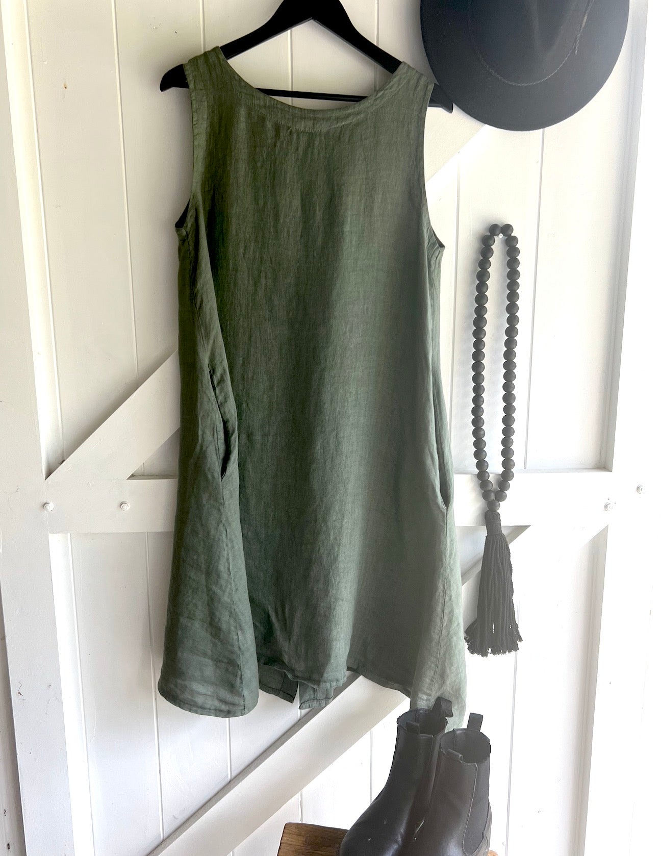 Made in Italy Cascade Linen Dress Olive - LUXAMORE -Dress-LUXAMORE Cascade Linen Dress breathable; with pockets, buttons and a longer back is a timeless wardrobe essential. Shop Italian linen dresses made in italy.