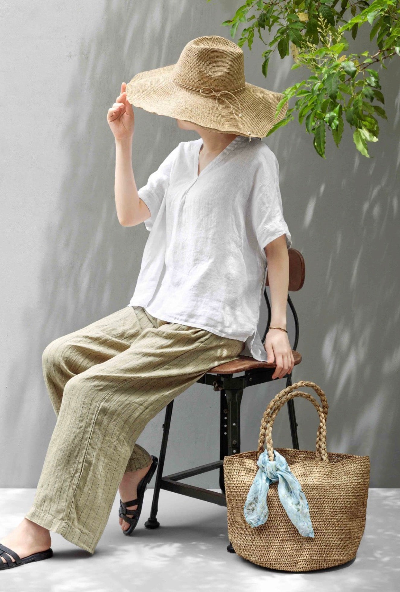 Woman Wearing Made in Mada Hat AZIZ - hat LUXAMORE