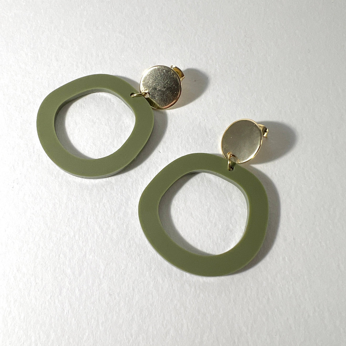Mingled Charlie Olive Green and Gold Dangle Earrings - LUXAMORE -Earings-The Charlie Olive Green and Gold Dangle earrings are a modern statement earring in lightweight hypoallergenic laser cut acrylic with a gold plated decorative stud disc. The stud post is made from hypoallergenic Surgical Stainless Steel (304). They are extremely lightweight, you won't even know you have them on.