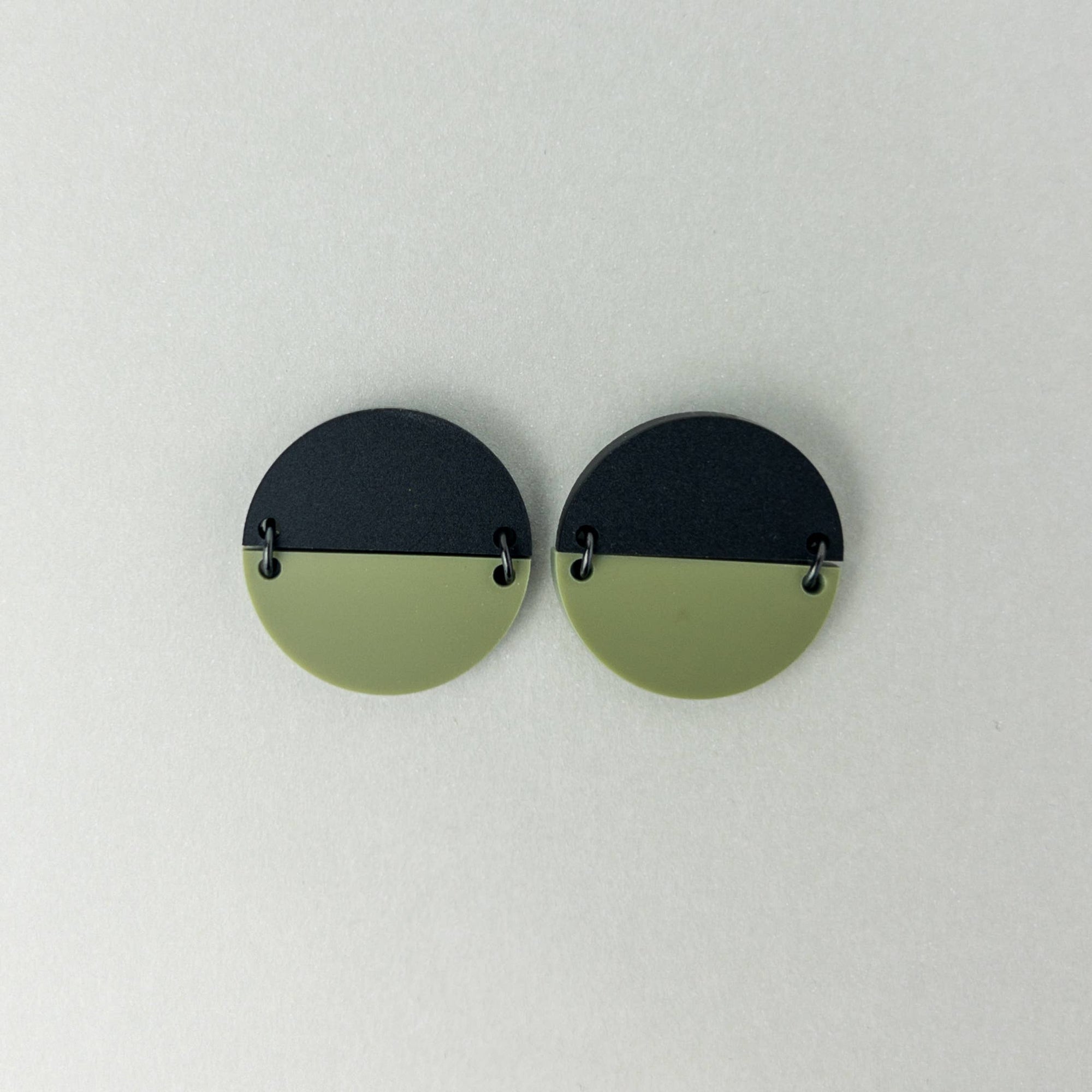 Mingled Statement Studs in Olive Green and Black - LUXAMORE --The TWO PIECE Statement Studs in Black and Olive Green are the perfect modern minimalist earrings. The geometric, large round half discs are joined with high quality black coated stainless steel jump rings Studs. Handmade in Australia with surgical steel hypoallergenic posts making them perfect for sensitive ears. Made from highly durable acrylic, these earrings are super lightweight, you won't even know you are wearing them.