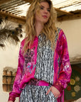 Miss Goodlife Pink Animal Love Blouse Made in Italy worn by model in natural setting LUXAMORE 
