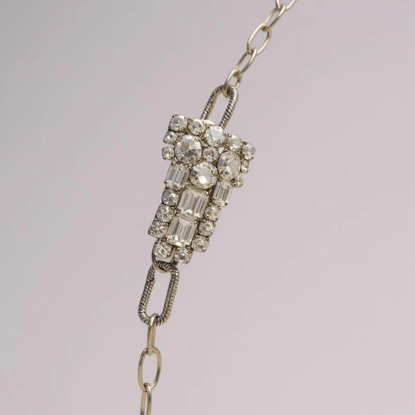 Orna Curio Vintage Bespoke Pearl and Diwali Flower Necklace - LUXAMORE -necklace-One of a Kind – Hand-crafted Necklace This elegant necklace features a vintage diamante crystal element, complemented by a sterling silver chain and fittings, with a vintage gold-plated garnet Indian floral centrepiece. This one of one necklace was handcrafted in Perth, WA. Measurements: 61cm Adjustable Materials: Sterling Silver 925 Chain and Hardware, Freshwater Pearls, Vintage Indian garnet and crystal Centrepiece.