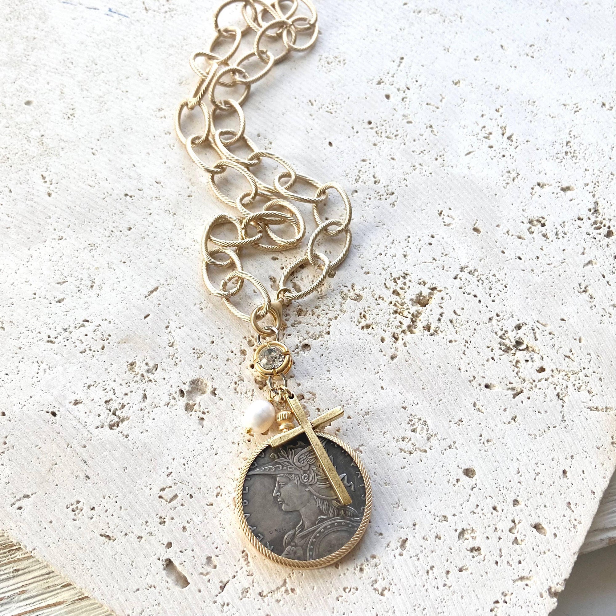 Pre Order Chunky coin necklace cross matte gold jewelry worn by model in natural setting LUXAMORE 