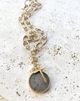 Pre Order Chunky coin necklace cross matte gold jewelry worn by model in natural setting LUXAMORE 