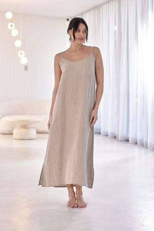 Soft, stylish linen dress with an elasticized back and adjustable straps, designed for relaxed elegance and all-day comfort