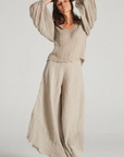 Estilo Emporio Fortune Top - LUXAMORE -Tops-Editors Notes A beautifully cut loose weave linen top, made in Positano Italy from Italian linen. This top fits true to size and is a must for any wardrobe. in a textured open weave, the Fortune Top has a boho luxe feel with an understated sleeve creating a contemporary fluid shape. Handmade in Italy the traditional way, Available now from LUXAMORE Colours available:Natural Italian linen Size is OSFA for small or extra small Style L4007