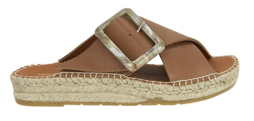 Estilo Emporio Husk Tan Slide - LUXAMORE -Shoes-Estilo Emporio Slide These espadrille slides have been handmade in Spain from vaqueta leather and topped with a tortoiseshell-embellished buckle. They have a platform heel and padded contoured leather footbeds to ensure a comfortable fit. Upper: LeatherInsole: LeatherOutsole: Rubber Height: 3cm Made in Spain