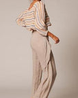 Estilo Emporio Poppy Top - Natural - LUXAMORE -Top-Editors notes: The Poppy Top - An Estilo best seller! Sheared elastic around waist with detail on sleeve, a classic boat neck design. Match with your favourite Estilo Flared pant for that European summer holiday. Handmade in Italy from 100% Italian Linen. Relaxed and stylish. An Italian summer classic that looks ..oh so fabulous! Model wears small Fabric - 100% Italian Linen, handcrafted in Italy